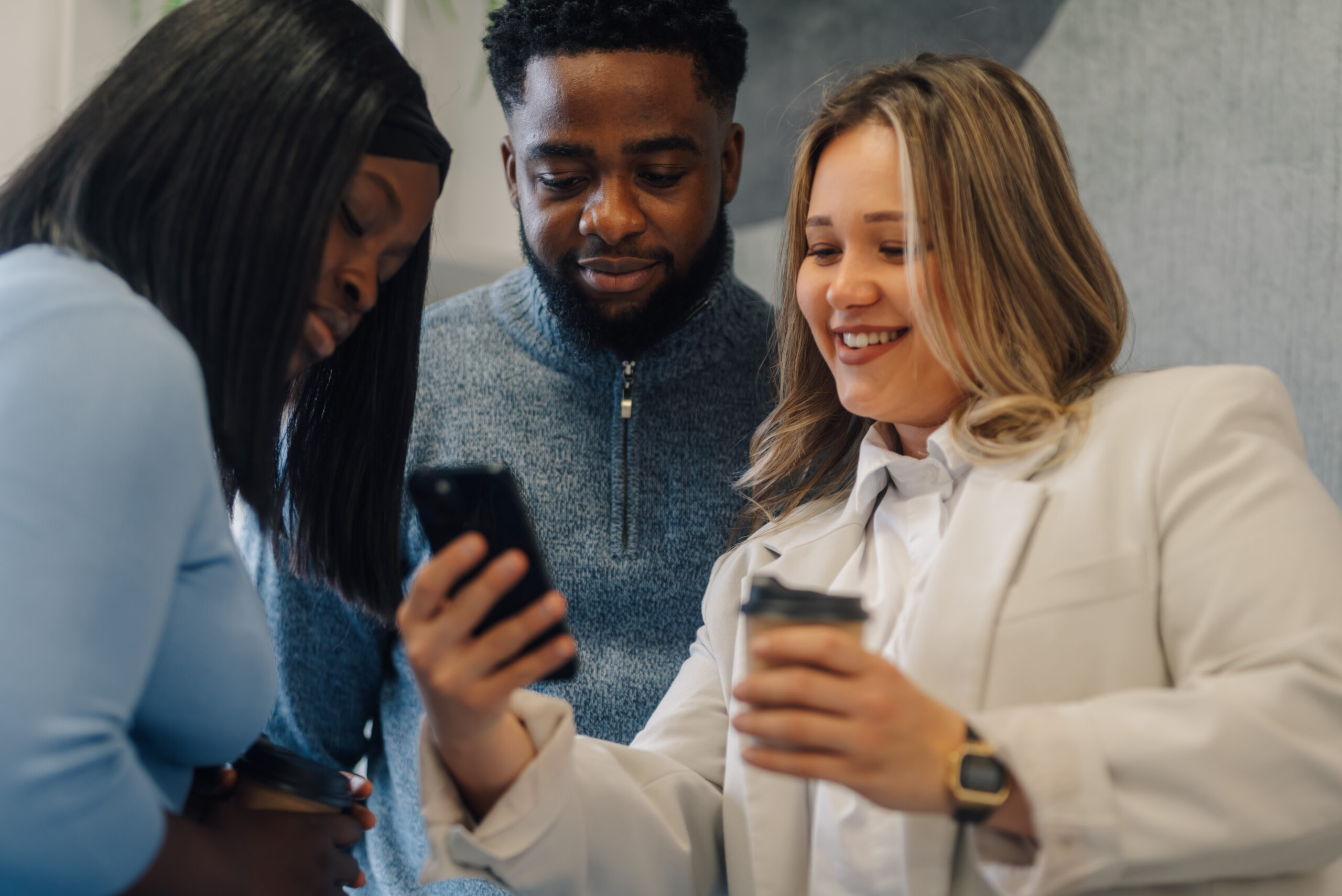 Customers looking at a memorable brand on a phone